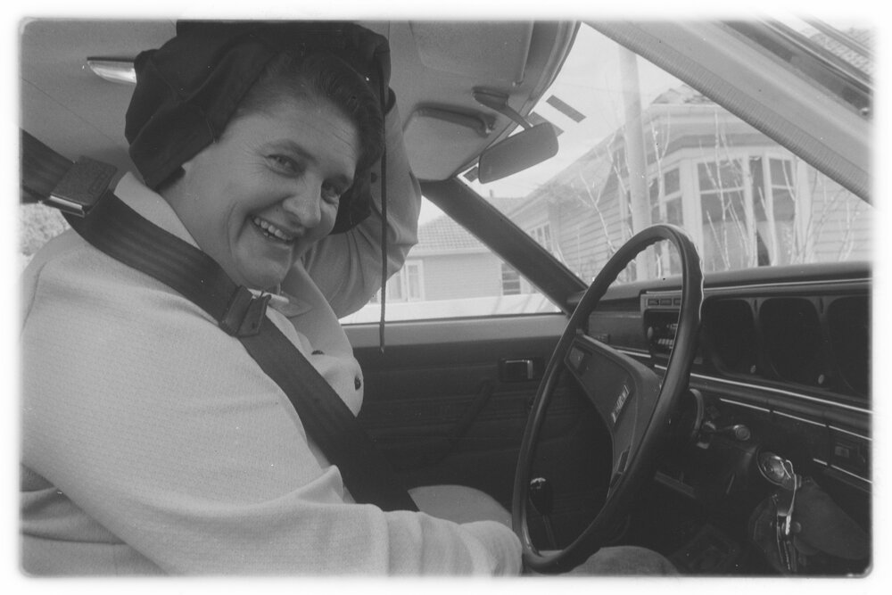 Hooded driver tackles hill - with a smile