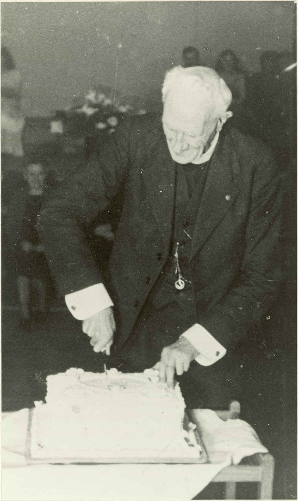 St. Augustine's golden jubilee: Archdeacon Russell cuts the cake