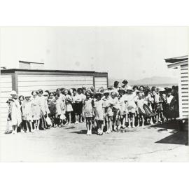 School children line up after swim