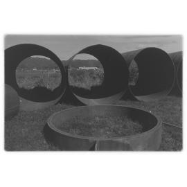 Buried tip site delays bridge