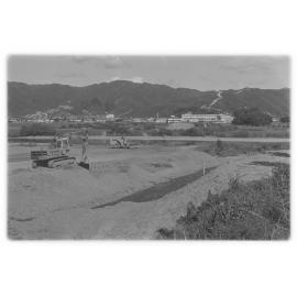 Buried tip site delays bridge